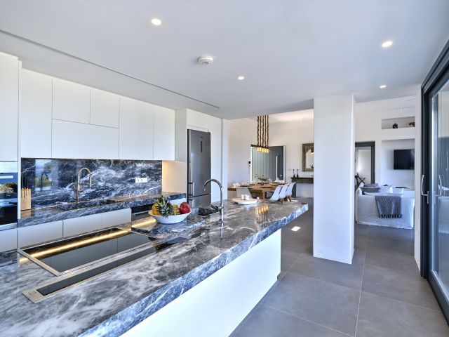 Fully equipped kitchen in House 1