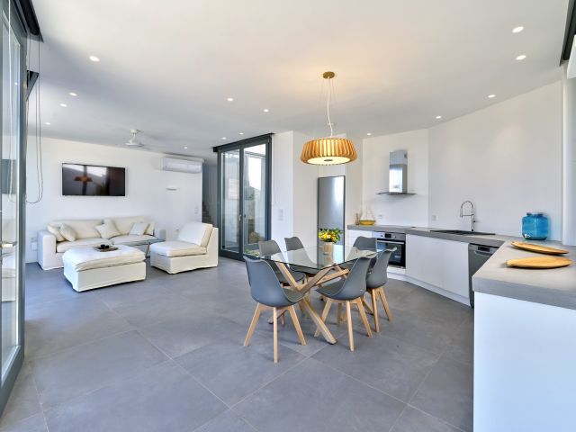 Living and dining area in House 2