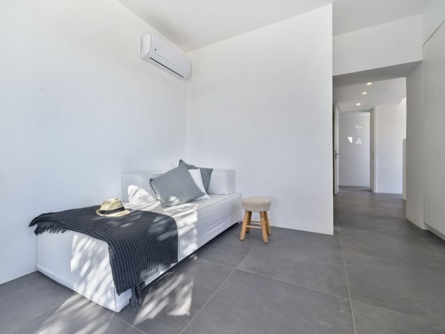 Sofa in master bedroom in House 1